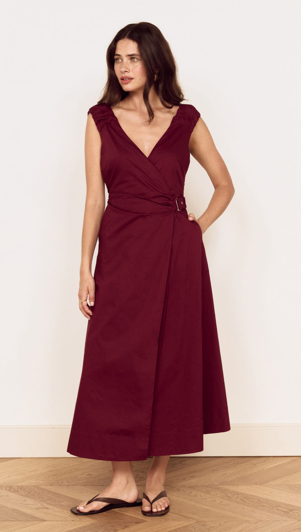 Cotton Wrap Detail Midi Dress in Burgundy worn by model, featuring deep V-neckline and belted waist.