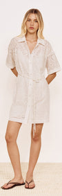 Cotton Broderie Mini Shirtdress in White worn by a model, featuring a relaxed silhouette and embroidered cotton design.