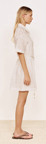 Cotton Broderie Mini Shirtdress in White displayed on a model, featuring a side view with relaxed fit and short sleeves.