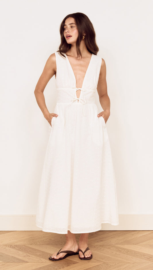 Cotton Broderie Anglaise Sleeveless Dress featuring a plunging V-neckline and side pockets in white.