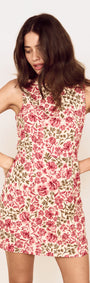 Model wearing a Vintage Floral Print Tie-Back Mini Dress with a playful floral design and fitted bodice.