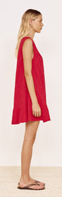 Cotton Broderie Mini Dress in Red displayed on a model, showcasing the V-neckline and frill hem.