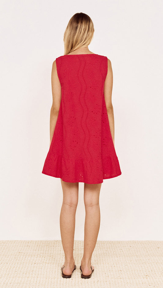 Back view of the Cotton Broderie Mini Dress in Red, showcasing its A-line silhouette and frill hem.