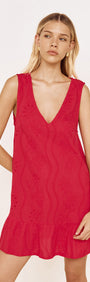 Cotton Broderie Mini Dress in Red worn by a model featuring a V-neckline and gathered frill hem.
