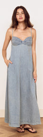 Fluid Denim Maxi Sundress in Lightwash displayed on a model with a fitted bust and flowing skirt.