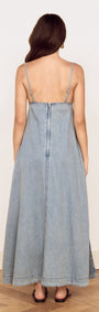 Back view of the Fluid Denim Maxi Sundress in Lightwash showcasing its flowing silhouette and delicate straps.