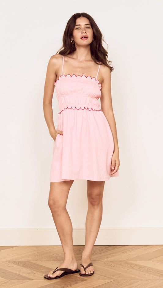 Linen Blend Mini Dress with Scallop Detail in soft pink with scalloped embroidery and adjustable straps.