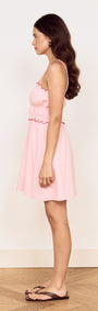 Linen Blend Mini Dress with Scallop Detail shown in soft pink, featuring a gathered bodice and scalloped embroidery.