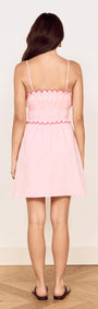 Linen Blend Mini Dress with Scallop Detail in soft pink, featuring a gathered bodice and adjustable straps.