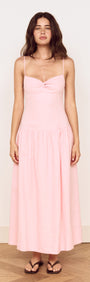 Linen Blend Midi Dress with Drop Waist displayed on a model in soft pink hue with twist-front detail and adjustable straps.