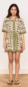 Model wearing a Scarf Print Shirt Dress in Olive with floral print and a self-tie waist belt.
