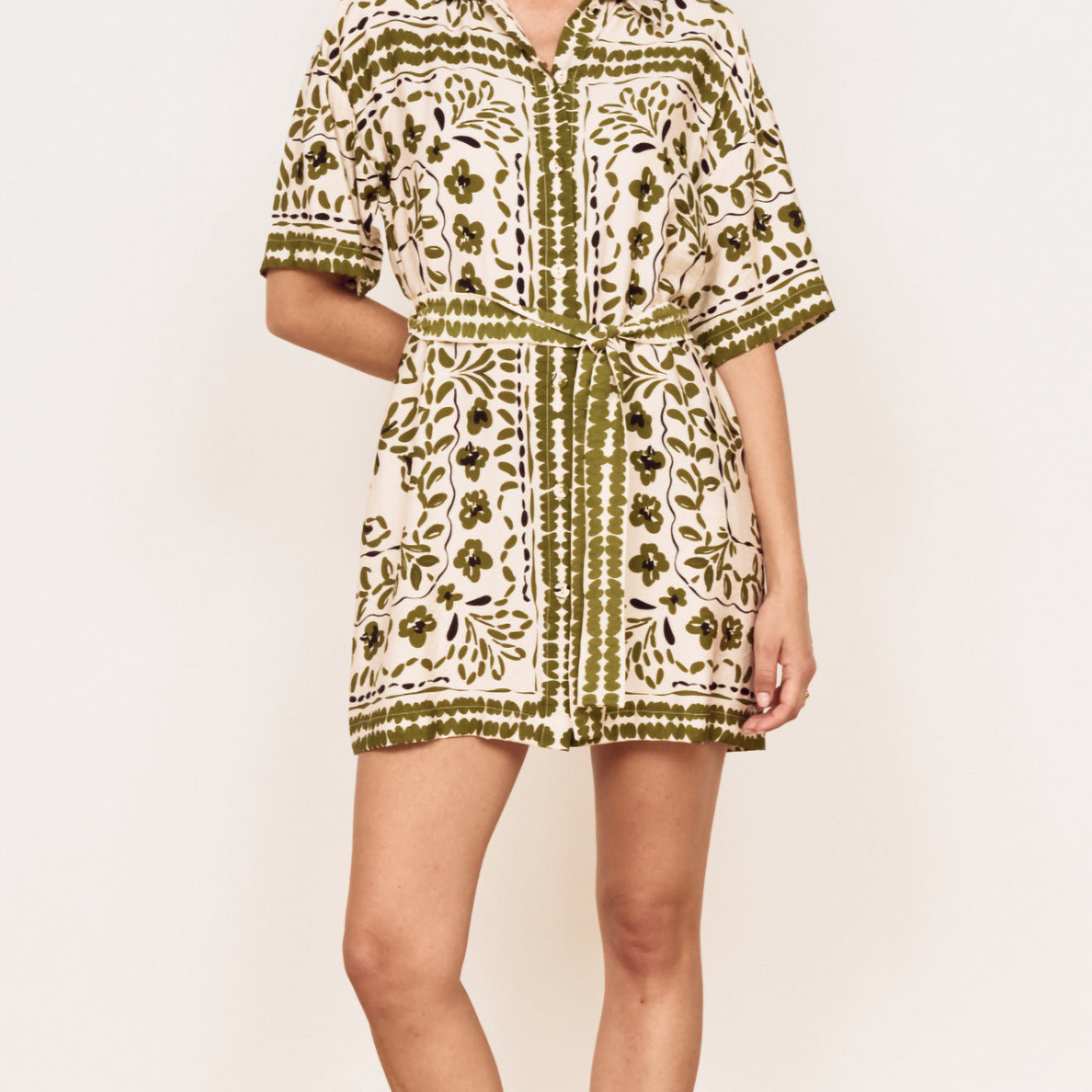 Model wearing a Scarf Print Shirt Dress in Olive, showcasing a floral print and relaxed silhouette.