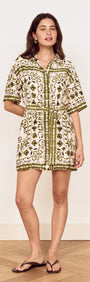 Model wearing a Scarf Print Shirt Dress in Olive, showcasing a floral print and relaxed silhouette.