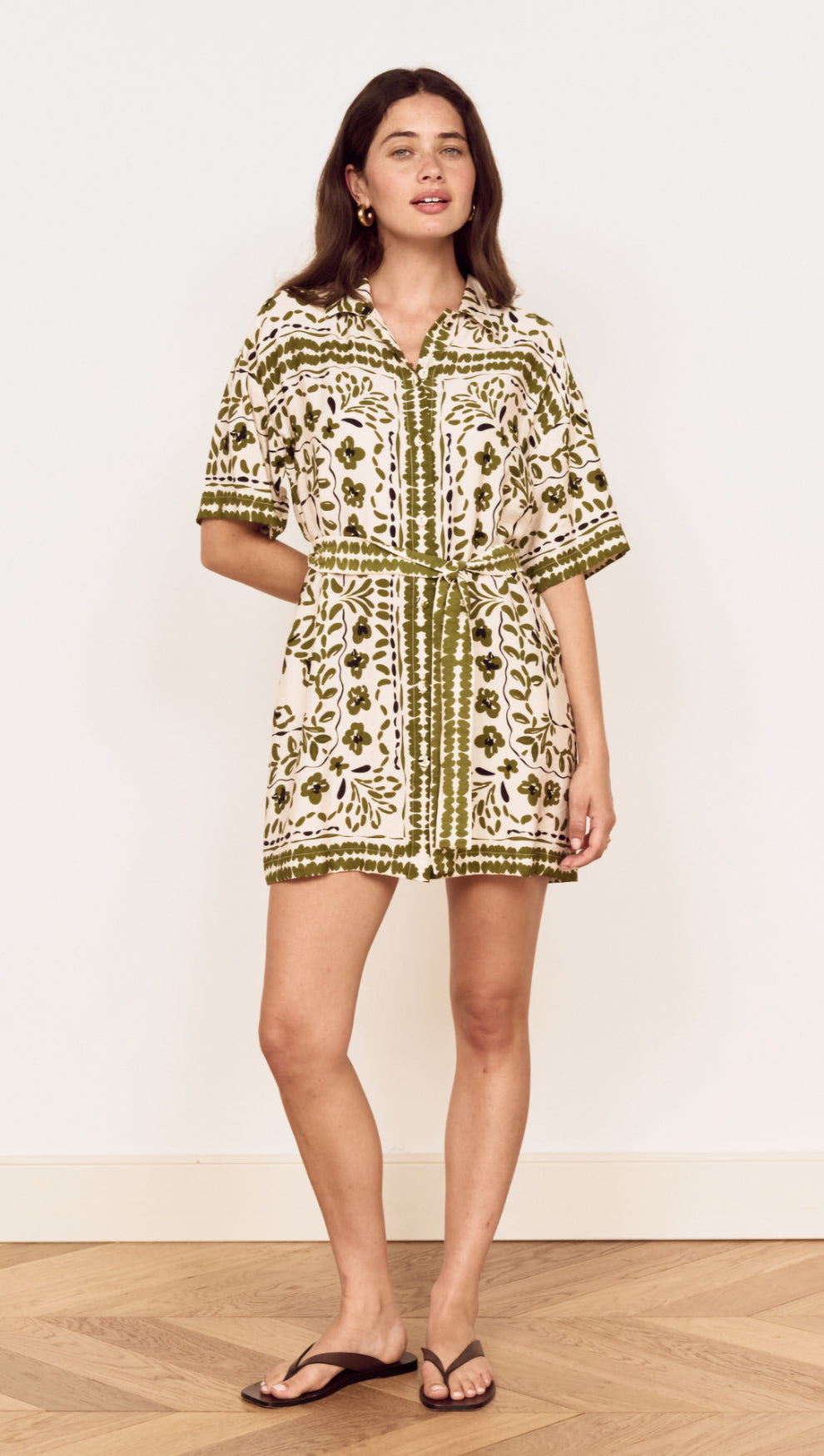 Model wearing a Scarf Print Shirt Dress in Olive, showcasing a floral print and relaxed silhouette.