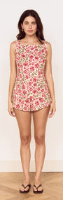 Model wearing Vintage Floral Print Mini Shorts with a matching floral top, showcasing a stylish warm-weather outfit.