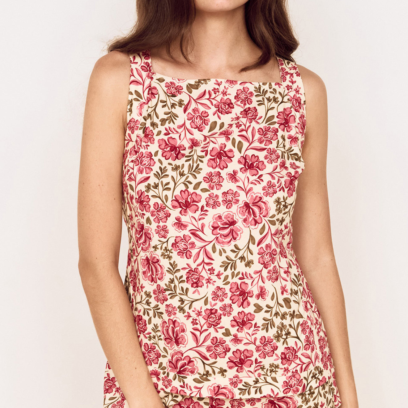 Vintage Floral Spring Tunic with Tie-Back worn by a model, showcasing vibrant floral print and stylish design.