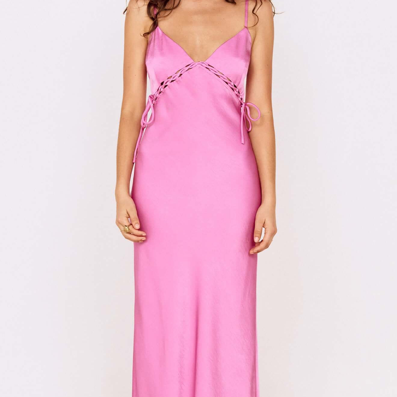 Fuchsia Bias Cut Maxi Dress with Lacing Detail worn by a model, showcasing a stylish and elegant silhouette.
