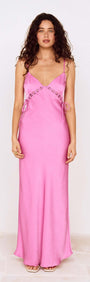 Fuchsia Bias Cut Maxi Dress with Lacing Detail worn by a model, showcasing a stylish and elegant silhouette.
