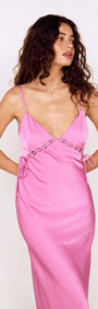 Fuchsia Bias Cut Maxi Dress with Lacing Detail worn by model, showcasing its elegant silhouette and stylish lacing.