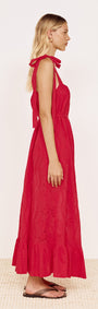 Cotton Broderie Maxi Sun Dress in Red worn by a model showcasing the side view and flowing silhouette.