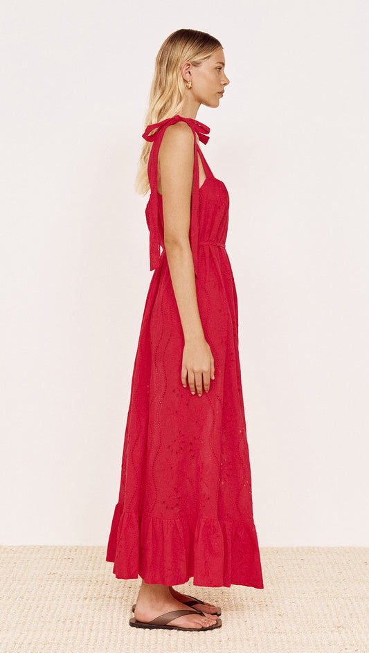 Cotton Broderie Maxi Sun Dress in Red worn by a model showcasing the side view and flowing silhouette.