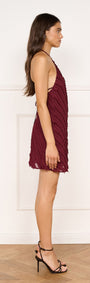 Fringe Detail Halter Mini Dress in Wine showcased on a model from the side, featuring a fringed texture and halter neckline.