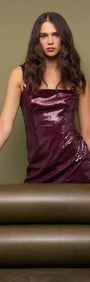 Model showcasing the Purple Sequin Mini Dress with burgundy sequins against a neutral background.
