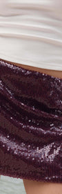 Purple Sequin Mini Skirt featuring a deep burgundy sequin fabric, perfect for parties and celebrations.