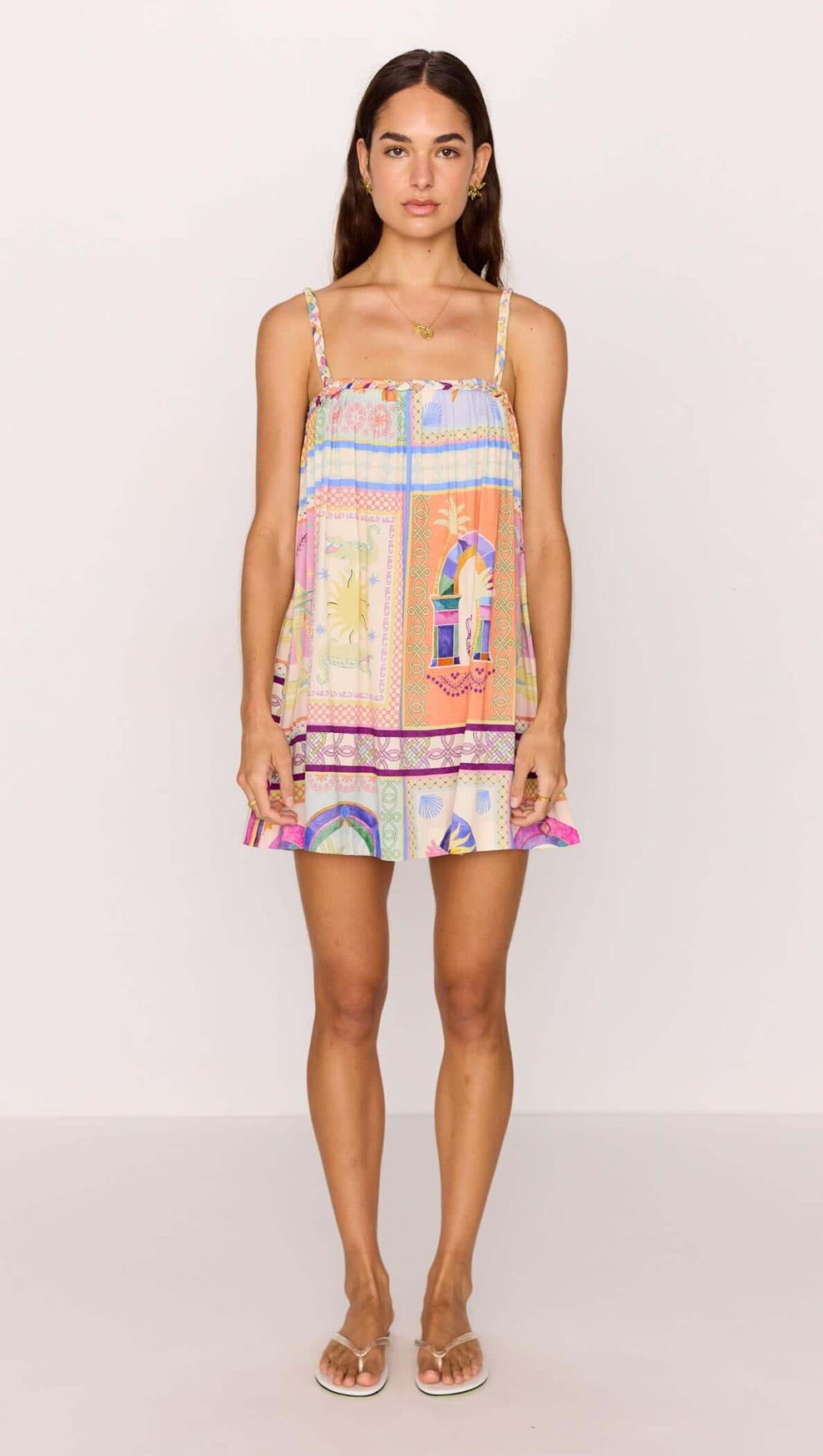 Model wearing a vibrant multicolour print Babydoll Mini Dress, ideal for summer with a playful and relaxed fit.