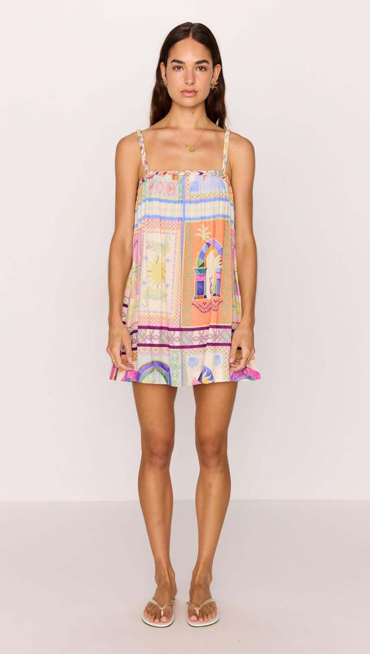 Model wearing a vibrant multicolour print Babydoll Mini Dress, ideal for summer with a playful and relaxed fit.