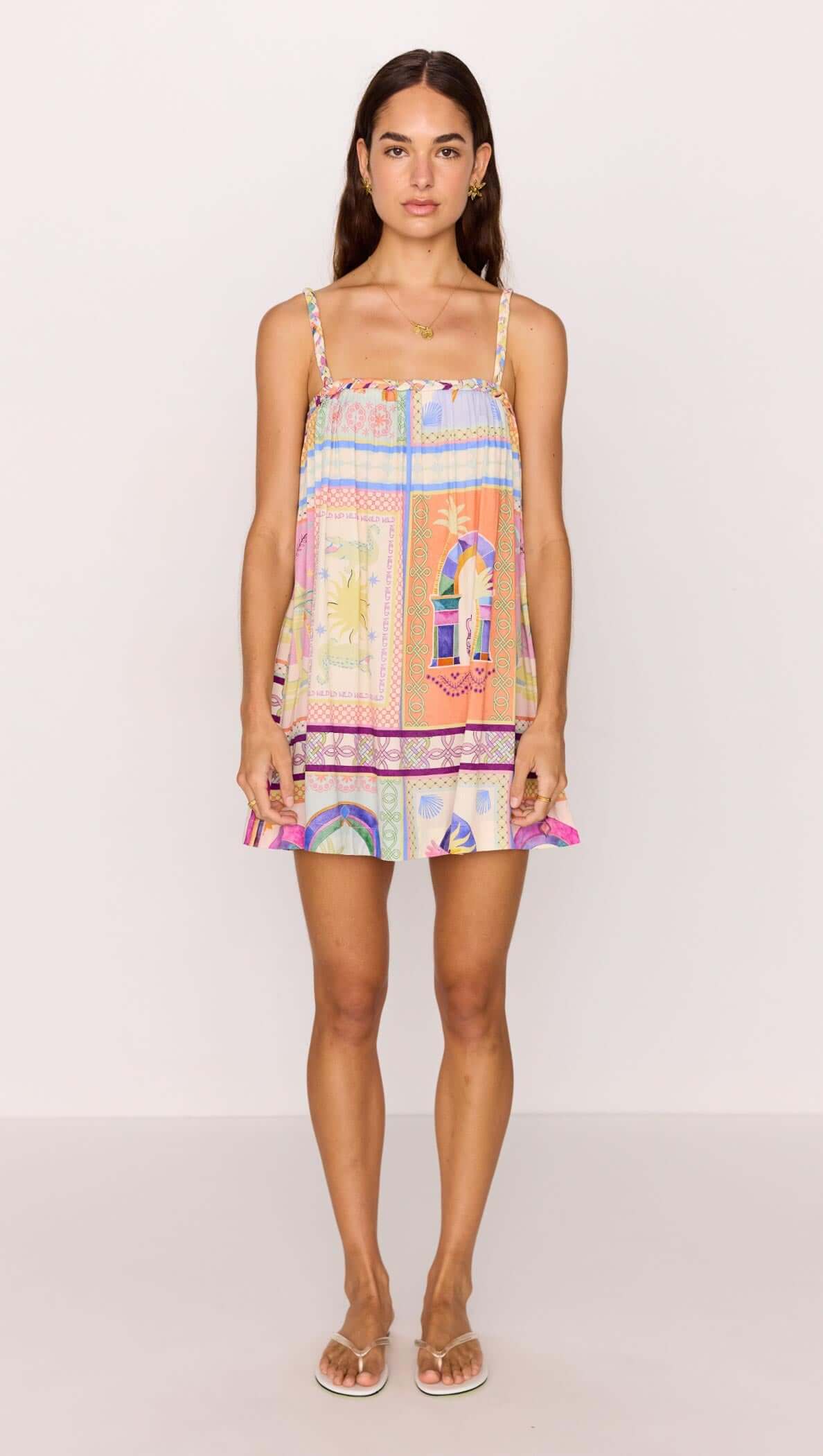 Model wearing a vibrant multicolour print Babydoll Mini Dress, ideal for summer with a playful and relaxed fit.