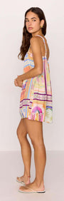 Elysia Babydoll Mini Dress in multicolour print, showcasing a playful summer style on model from the back.