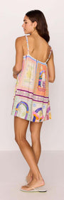 Back view of a woman wearing a multicolour print babydoll mini dress, perfect for summer style and casual outings.