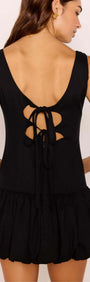 Back view of the Cotton Linen Blend Black Bubble Mini Dress showcasing scoop neckline and tie detailing