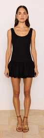 Cotton Linen Blend Black Bubble Mini Dress modeling a scoop neckline and dramatic bubble hem in black.