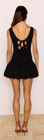 Cotton Linen Blend Black Bubble Mini Dress showcasing an open back with tie detailing and dramatic bubble hem.