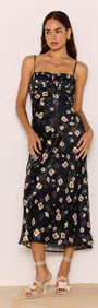 Black Floral Bias Midi Dress showcased on a model, featuring a soft satin finish and flattering bias cut.