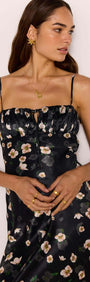 Black Floral Bias Midi Dress displayed on a model showcasing the ruched bust and floral satin finish.