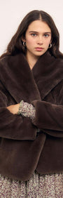 Model wearing a stylish Brown Faux Fur Coat with an oversized collar for a chic winter look.