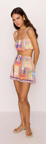 Model wearing Elysia Bubble Crop Top with Tie Straps in Multicolour Print, featuring a playful summer design.