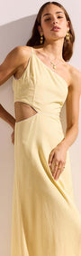Butter Yellow Asymmetric Cut Out Maxi Dress showcased by a model, highlighting the chic design and flowing fabric.