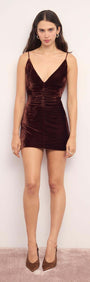 Chocolate Velvet V-Neck Mini Dress featuring a plunging neckline and ruched bust for a flattering fit.