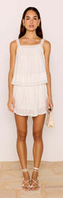 Lace Detail White Cotton Mini Skirt worn with a matching top, showcasing a relaxed silhouette and playful frill hem.