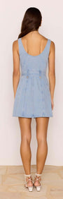 Back view of Denim Button Mini Dress showcasing adjustable D-ring belt and comfortable fit, perfect for warm days.
