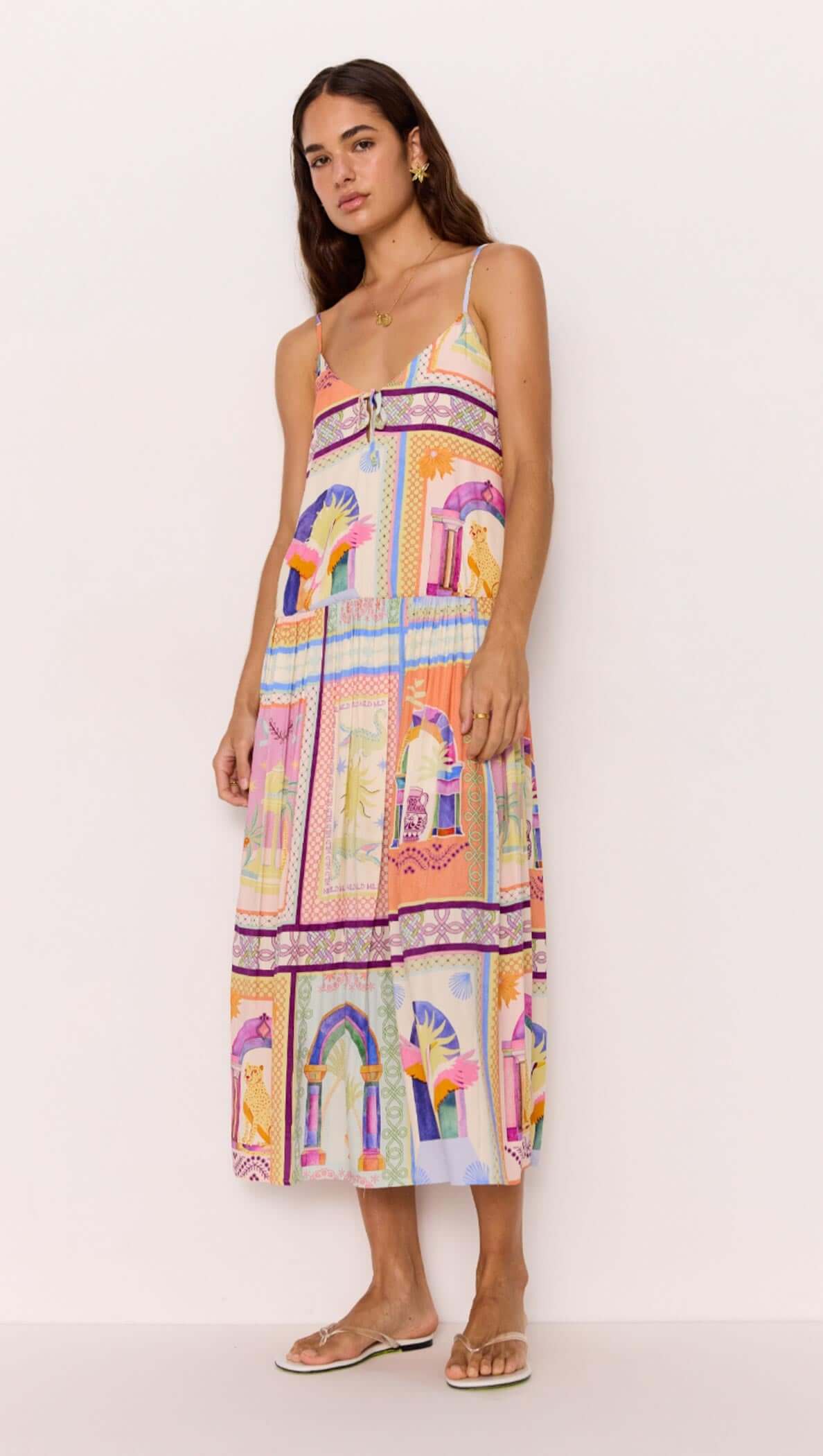 Model wearing a multicolour printed dropped-waist strappy midi dress, perfect for resort fashion.