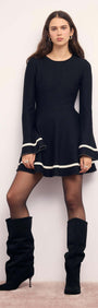 Black Peplum Knit Mini Dress With Contract Trim featuring long sleeves and flared cuffs