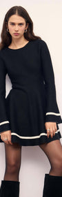 Black Peplum Knit Mini Dress With Contract Trim featuring long sleeves and fluted hem, perfect for a chic look.