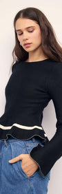 Black Peplum Knit Top With Contrast Trim, featuring long sleeves and a playful peplum hem for a chic look.