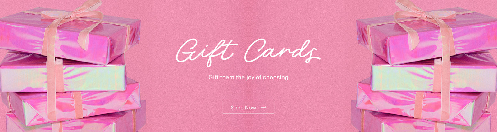 Colorful gift cards stacked on pink background, promoting the joy of choosing gifts, perfect for any occasion.
