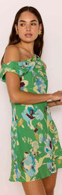 Model wearing Green Floral Asymmetric Mini Dress with a fresh green floral print and softly draped neckline.